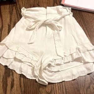 white flowy shorts with ruffles